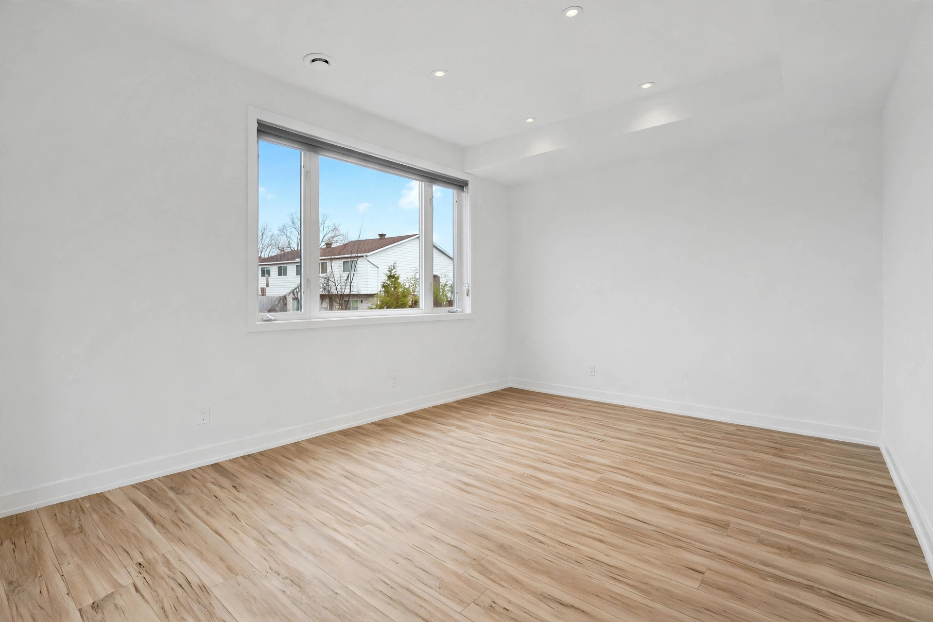 Empty warm contemporary primary bedroom before virtual staging